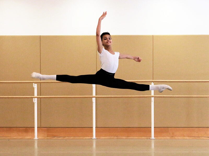 Boy leaping through the air in jump